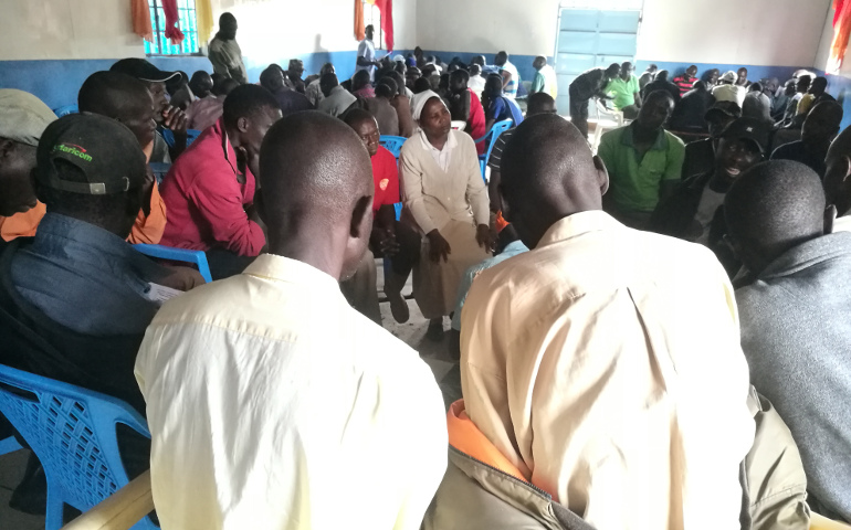 Sr. Josephine Muthoni Kwenga listens to Kibera residents with questions on the voting process during a voter education forum. Sisters are on the front lines as Kenya prepares for an historic repeat election. (Lilian Muendo)