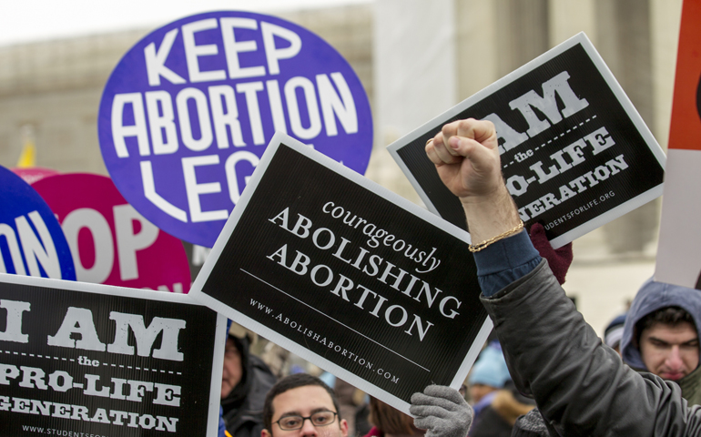 Opposing sides of the abortion issue collide in front of the Supreme Court building during the March for Life in Washington Jan. 25. (CNS/Daniel Sone) 