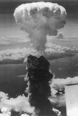 A column of smoke rises over Nagasaki, Japan, after an atomic bomb hit it Aug. 9, 1945. (Library of Congress)