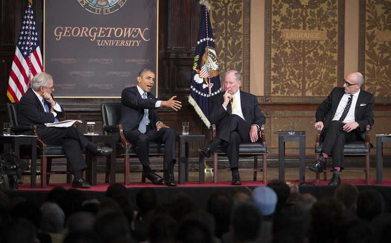 From left, E.J. Dionne, Robert Putnam and Arthur Brooks listen to President Barack Obama speak Tuesday during the Catholic-Evangelical Leadership Summit on Overcoming Poverty at Georgetown University in Washington. (CNS/Tyler Orsburn)