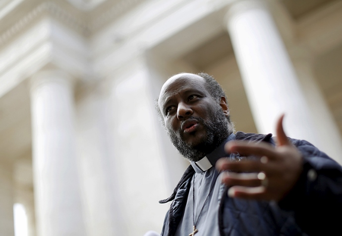 Eritrean priest Mussie Zerai gestures during an interview in front of St. Peter’s Square at the Vatican on Sept. 30, 2015. Zerai, who has helped some of the thousands of African migrants who have risked their lives to cross the Mediterranean Sea, was among the nominees for this year’s Nobel Peace Prize. (Religion News Service, photo courtesy of REUTERS/Alessandro Bianchi)