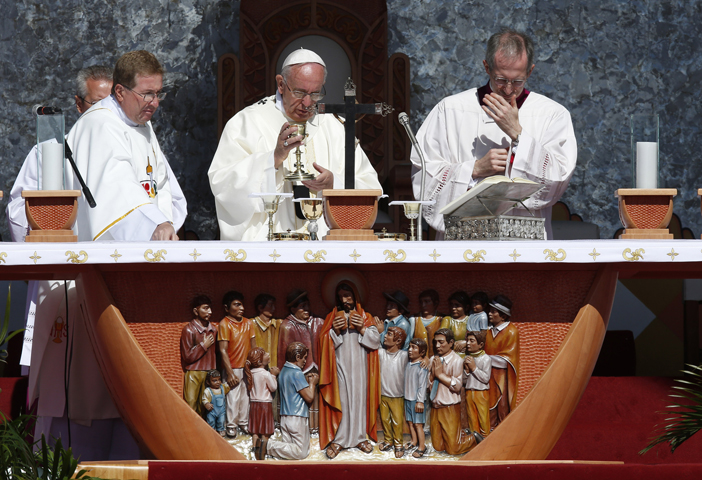 Pope Francis celebrates the Eucharist during Mass on Thursday in Christ the Redeemer Square in Santa Cruz, Bolivia. (CNS/Paul Haring)