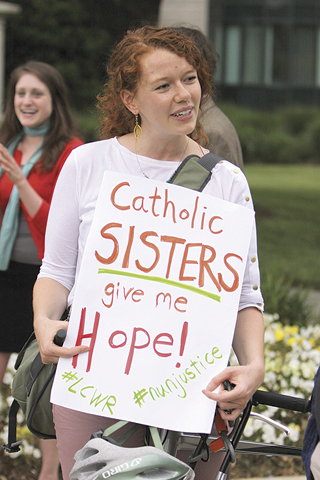 A protester joins others in front of the U.S. Conference of Catholic Bishops building in Washington, D.C., on May 8, 2012, in support of Catholic sisters. (Ted Majdosz)