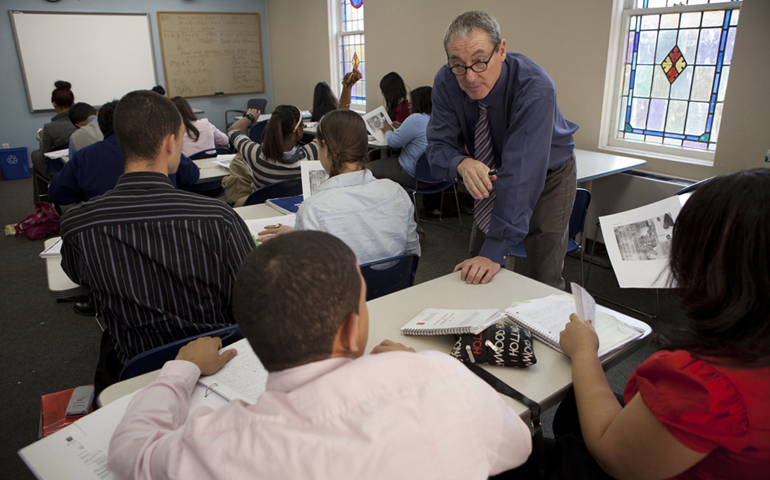 Tom Sites, right, has spent the last five years teaching.