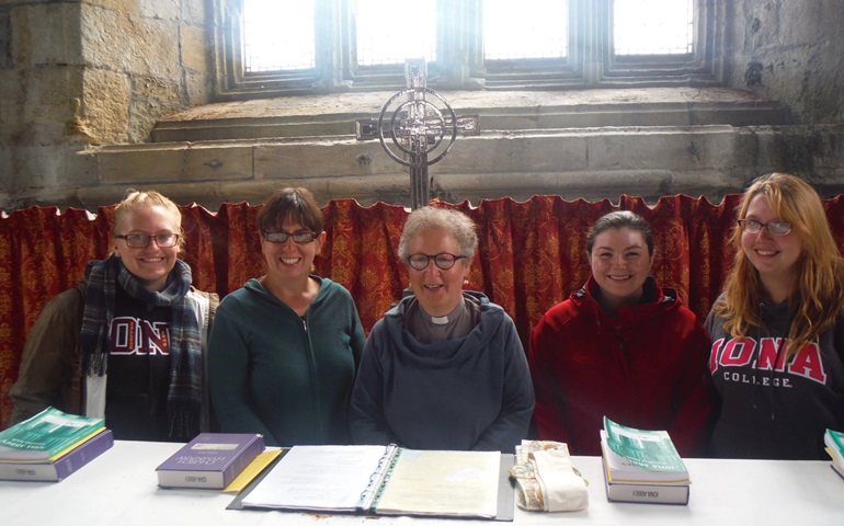 Students, faculty and staff from Iona College stand behind the altar at Iona Abbey. From left, Charlotte Ference, Christina Carlson, Sharon Kyle, Kaylynn Murchson and Michelle Muzzio. 