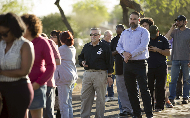 People wait to vote in the U.S. presidential primary election outside a polling site in Glendale, Ariz., March 22. (Newscom/Reuters/Nancy Wiechec)