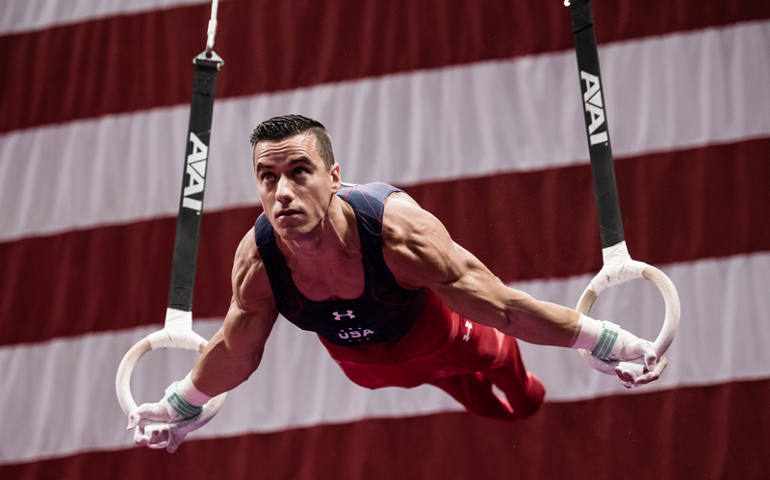 Jake Dalton on the still rings. (Photo by John Cheng)