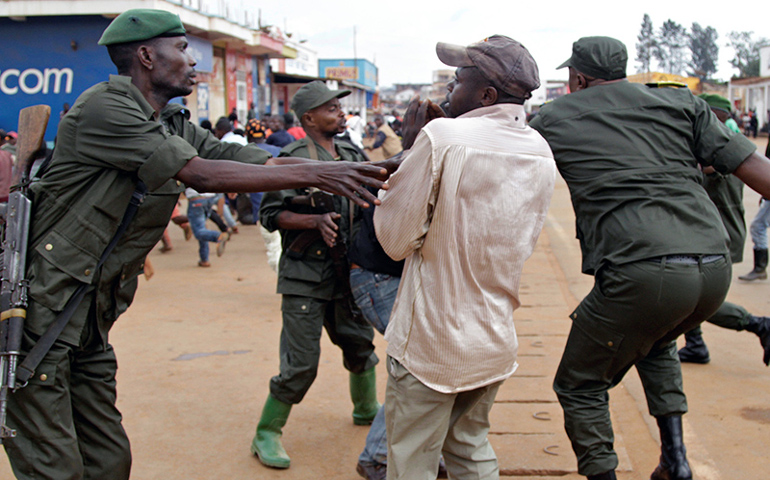 Congolese soldiers arrest civilians protesting against the government's failure to stop the killings and interethnic tensions in the town of Butembo in the country's North Kivu province, on Aug. 24, 2016. (Photo by Kenny Katombe/Reuters)