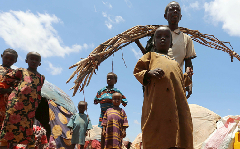 Internally displaced Somali people are seen outside their shelter after fleeing from drought-stricken regions at a makeshift camp in Baidoa, west of Somalia's capital of Mogadishu, on March 26, 2017. (Reuters/Feisal Omar)