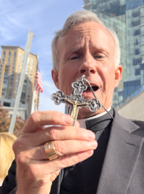 Bishop Joseph Strickland shows his pectoral cross on Nov. 14, 2023. (NCR photo/Brian Fraga) 