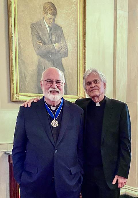 Jesuit Frs. Greg Boyle and Mark Torres pose for a photo at the White House after the Presidential Medal of Freedom ceremony on May 3. (Courtesy of Mark Torres)