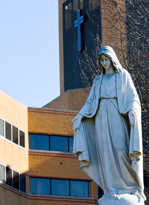 A statue of Mary is seen in a 2007 photo outside St. Elizabeth's Medical Center in Boston, the flagship hospital of the Boston Archdiocese's Caritas Christi Health Care system. The archdiocese sold the chain of hospitals in 2010. (CNS/The Pilot/Gregory L. Tracy)