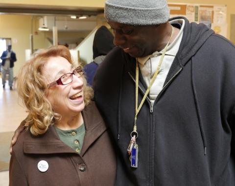 Sr. Grace Miller of Rochester, New York, left, walks with a person who is homeless at the House of Mercy. The 84-year-old sister started the homeless shelter more than 30 years ago as of May 2020. (CNS/Courtesy of the House of Mercy)