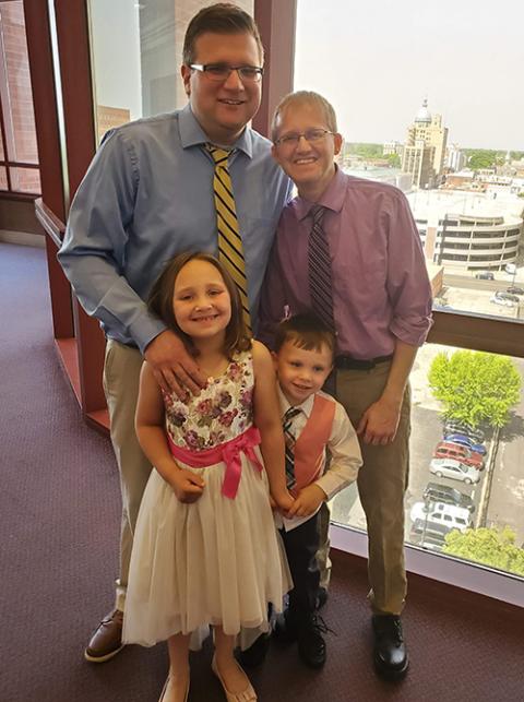 John Freml, left, with husband Rick Nelson and their children Jordan Freml-Nelson, front left, and Riley Freml-Nelson. (Courtesy of John Freml)