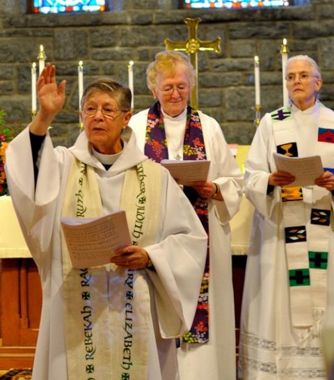 Nancy Wittig blesses the congregation, with Marie Moorefield Fleischer and Emily Hewitt nearby, during the memorial service for Alison Cheek Nov. 2 at St. Philip’s Episcopal Church in Brevard, North Carolina. (Darlene O’Dell)