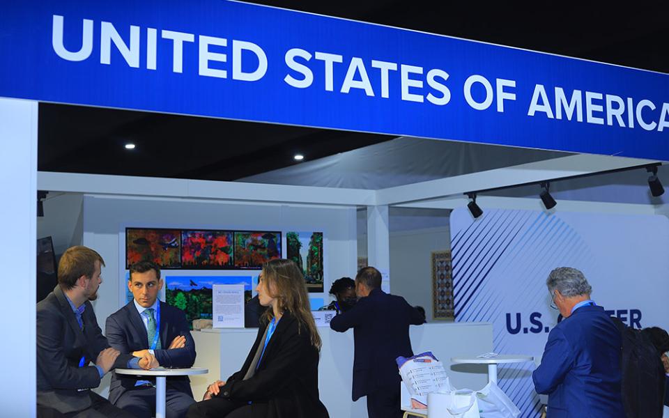 Delegates engage in discussions at the United States of America’s pavilion during COP 29 in Baku, Azerbaijan, Nov. 11-22. (NCR photo/Doreen Ajiambo)