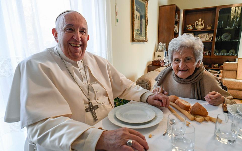 Pope Francis and his cousin Carla Rabezzana sit down for lunch in her home in Portacomaro, near Asti, Nov. 19, 2022. The pope traveled to the northern Italian town to help celebrate Rabezzana's 90th birthday, to visit other relatives and to celebrate Mass the next day in the Asti cathedral. (CNS/Vatican Media)