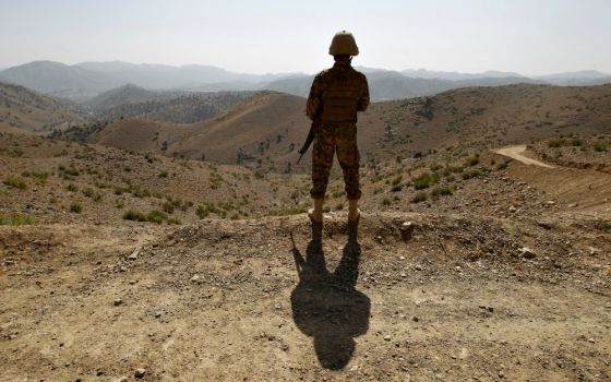 A soldier in North Waziristan, Pakistan, stands guard along the border fence with Afghanistan Oct. 18, 2017. (CNS/Reuters/Caren Firouz)