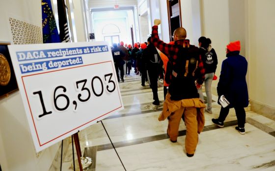 Demonstrators calling for new protections for recipients of the Deferred Action for Childhood Arrivals program walk through a Senate office building on Capitol Hill in late January in Washington. (CNS/Reuters/Jonathan Ernst)