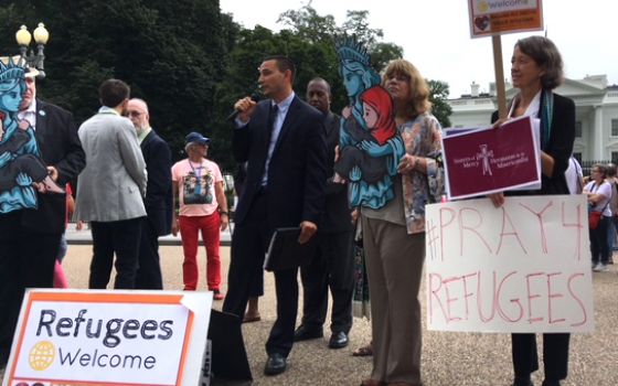 Catholics join other religious organizations and groups near the White House in Washington Sept. 12 urging the administration to allow 75,000 refugees into the country next fiscal year. (CNS/Rhina Guidos)