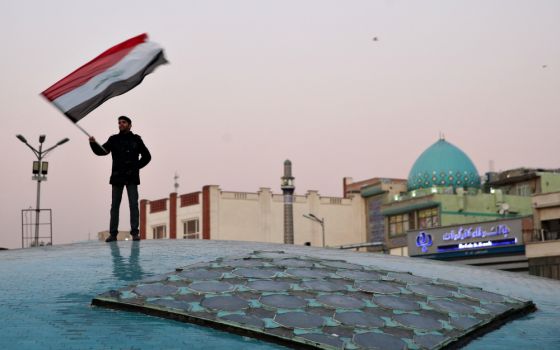 A man celebrates in Tehran, Iran, Jan. 8 after the country launched missiles at U.S.-led forces in Iraq. (CNS/West Asia News Agency via Reuters/Nazanin Tabatabaee) 