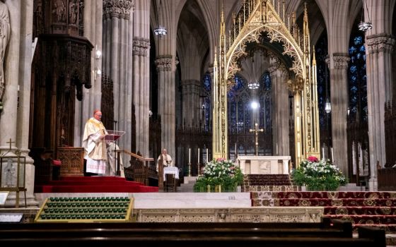 New York Cardinal Timothy Dolan celebrates Easter Mass at St. Patrick's Cathedral April 12 during the coronavirus pandemic. (CNS/Reuters/Jeenah Moon)