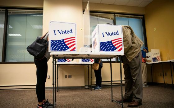 People fill out their ballots at an early voting site in Arlington, Virginia, Sept. 18. (CNS/Reuters/Al Drago)