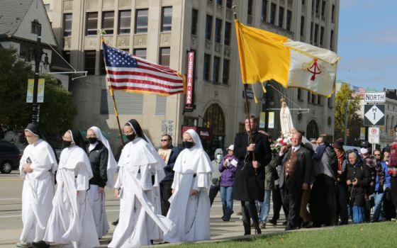 Women religious and other Catholics in Detroit march during a Unite Our Nation procession Oct. 31. (CNS/Detroit Catholic/Dan Meloy)