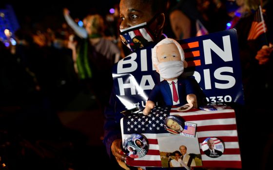 A supporter holds a Biden figurine during President-elect Joe Biden's victory speech Nov. 7 in Wilmington, Delaware. (CNS/Mark Makela, Reuters)