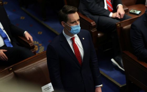 Sen. Josh Hawley, R-Mo., stands to object to the Pennsylvania Electoral College vote a joint session of Congress in Washington Jan. 6. (CNS/Reuters/Jonathan Ernst)