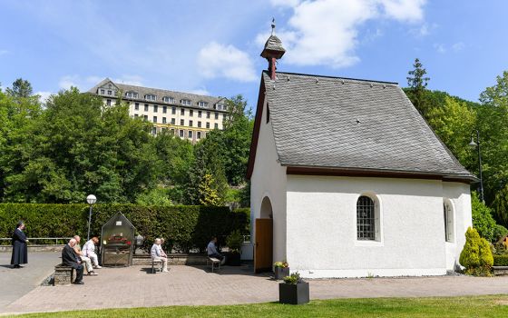 Pilgrims pray in front of the original Schonstatt Shrine in Vallendar, Germany, May 21, 2020. German Bishop Stephan Ackermann of Trier has ordered the reexamination of abuse allegations against Fr. Joseph Kentenich, founder of the Schonstatt movement, fro