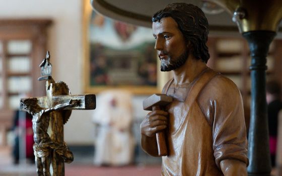 A statue of St. Joseph is seen as Pope Francis leads his general audience in the library of the Apostolic Palace at the Vatican March 24. (CNS/Vatican Media)