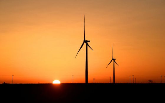 Wind turbines operate at sunrise in the Permian Basin oil and natural gas production area in Big Spring, Texas, Feb. 12, 2019. (CNS photo/Nick Oxford, Reuters)