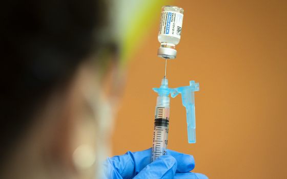 A health care worker at Catholic Charities in Washington prepares to administer the Johnson & Johnson COVID-19 vaccine May 18. (CNS/Tyler Orsburn)