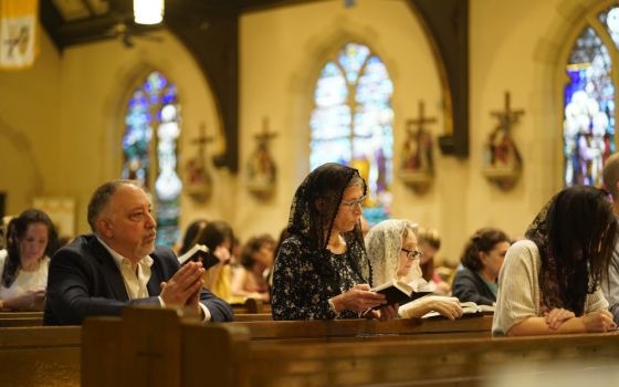 Worshippers attend a traditional Latin Mass July 18 at St. Josaphat Church in the Queens borough of New York City. The parish, located in the Diocese of Brooklyn, celebrates a traditional Latin Mass on Sundays and five other days of the week. (CNS)