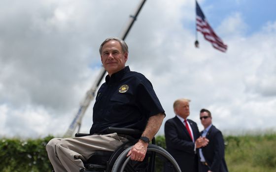 Texas Gov. Greg Abbott exits the stage with former President Donald Trump after a visit to an unfinished section of the wall along the U.S.-Mexico border in Pharr, Texas, June 30. (CNS/Reuters/Callaghan O'Hare)