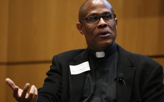 Fr. Bryan Massingale is seen during a 2017 panel discussion in New York. (CNS/Fordham University/Bruce Gilbert)