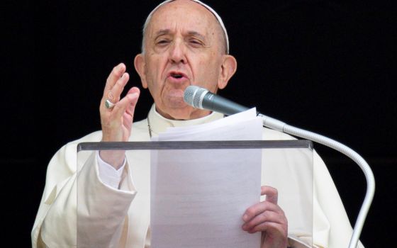 Pope Francis speaks as he leads the Angelus from the window of his studio overlooking St. Peter's Square at the Vatican Sept. 26, 2021. (CNS photo/Vatican Media)