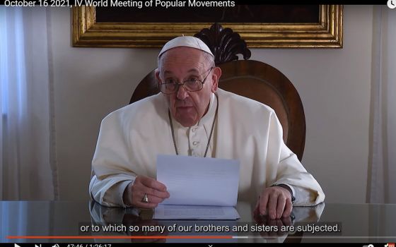 Pope Francis speaks in a video message to the World Meeting of Popular Movements in this still image taken from video posted to the Vatican News YouTube channel Oct. 16. (CNS/Vatican News YouTube channel)