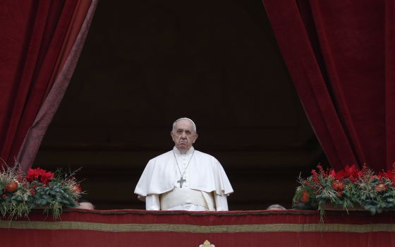 Pope Francis leads his Christmas message and blessing "urbi et orbi" (to the city and the world) from the central balcony of St. Peter's Basilica at the Vatican Dec. 25, 2021. (CNS photo/Paul Haring)