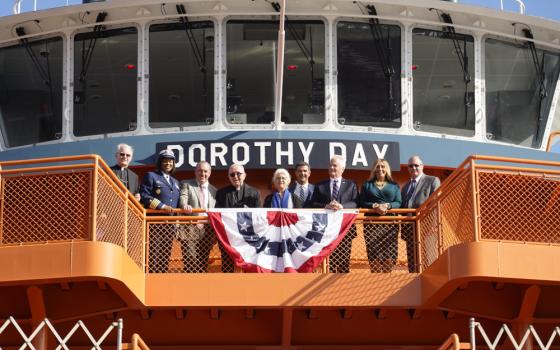 Martha Hennessy, center, granddaughter of Dorothy Day, gathers with other dignitaries Nov. 4, 2022, during a commissioning ceremony for the Dorothy Day ferry boat at St. George Ferry Terminal in Staten Island, N.Y.  