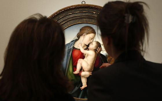 Women view "The Madonna and Child" by Fra Bartolommeo as it hangs in Christie's gallery Jan. 29, 2013, in New York. (CNS/Reuters/Mike Segar)