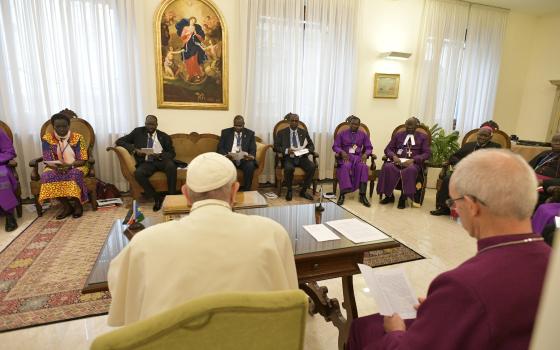 Pope Francis is seated next to Anglican Archbishop Justin Welby of Canterbury, England, spiritual leader of the Anglican Communion, during a meeting at the end of a two-day spiritual retreat with South Sudanese leaders at the Vatican in this April 11, 2019, file photo. The pope plans to visit South Sudan July 5-7. (CNS photo/Vatican Media via Reuters)