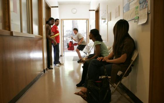 Jamila Griffith, left, calls a student for an appointment in the financial aid office at Holy Names University in Oakland, Calif., Aug. 17, 2007. University officials announced Dec. 19, 2022, that the school will close in May 2023 after educating students for 154 years. (CNS/Greg Tarczynski)