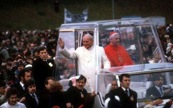 St. John Paul II and Cardinal Joseph Ratzinger ride in the popemobile during a visit to Germany in 1980. The cardinal -- now retired Pope Benedict XVI -- headed the Archdiocese of Munich 1977-1981. (CNS photo/KNA)