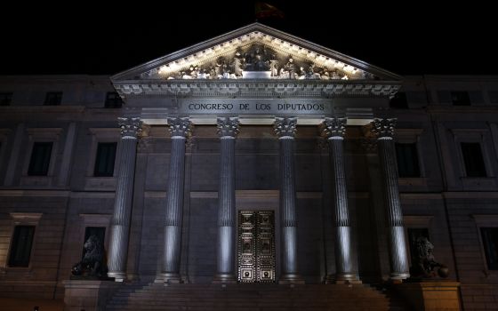 The Spanish parliament building is seen at night in central Madrid, March 2, 2016. (CNS photo/Sergio Perez, Reuters)