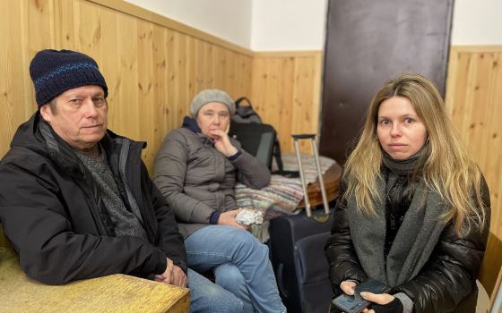 Oleg and Valentina Malakhivska are pictured with their daughter, Iuliia, at a refugee center in Barabás, Hungary, March 11, 2022. (CNS photo/Junno Arocho Esteves)