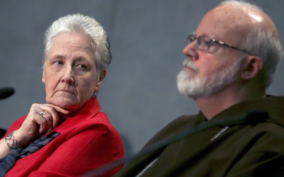 Irish abuse victim Marie Collins looks at Boston Cardinal Seán P. O'Malley during a briefing at the Holy See press office at the Vatican May 3, 2014. (CNS photo/Alessandro Bianchi, Reuters)