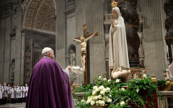 Pope Francis burns incense in front of a Marian statue after consecrating the world and, in particular, Ukraine and Russia to the Immaculate Heart of Mary during a Lenten penance service in St. Peter's Basilica at the Vatican. (CNS/Vatican Media) 