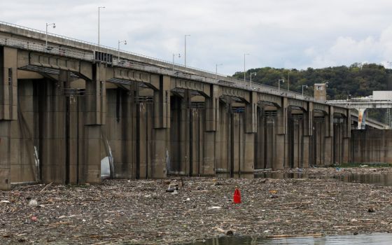 Garbage and debris pile up behind the Markland Locks and Dam on the Ohio River in Florence, Ind., Sept. 14, 2017. (CNS/Reuters/Brian Snyder)